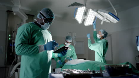 surgeons in an operating room, focused on a procedure in a hospital