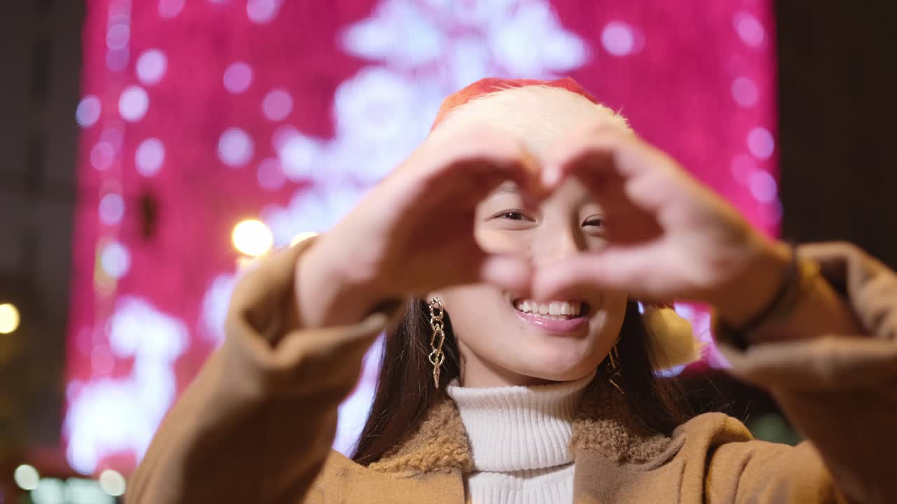 Festive portrait of a woman in a Santa hat