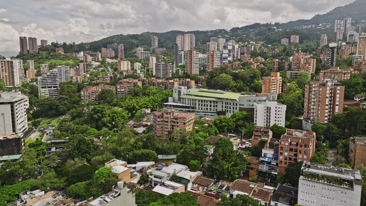 Medellin Colombia Aerial v6 drone flyover and around El Poblado and Las Lomas I neighborhoods capturing Vizcaya business center and residential areas - Shot with Mavic 3 Cine - November 2022