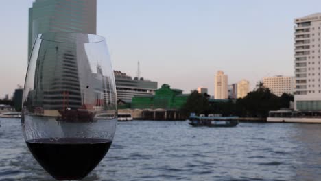 urban skyline mirrored in glass over water