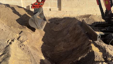 scooping digging soil sand hole earthworks digger construction perth