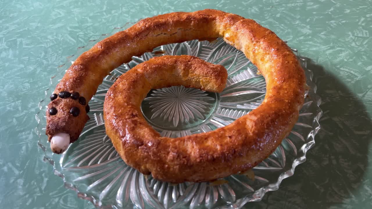Close up of a freshly baked traditional Italian cake, the Torciglione or tortiglione, shaped like a snake. For cooking, holiday, or cultural content