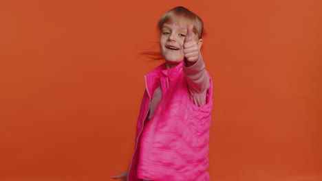 Toddler-girl-raises-thumbs-up-agrees-or-gives-positive-reply-recommends-advertisement-likes-good