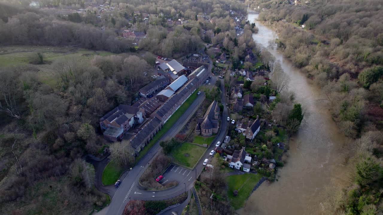 Houses in danger of being flooded Ironbridge gorge England Uk done view