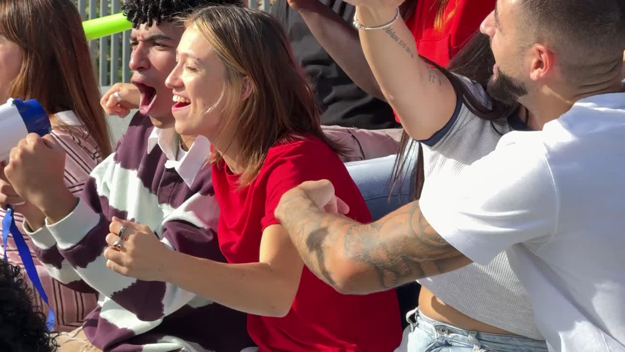 Enthusiastic fans cheering for their team