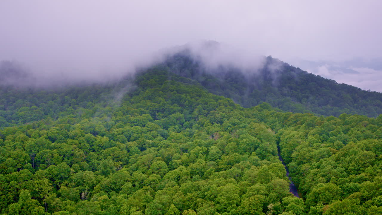 Great Smokies hidden beneath layers of mist and fog in drone view
