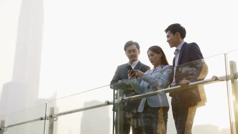 asian office workers discussing business outdoors