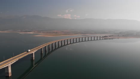 aerial panning shot of long lake bridge and