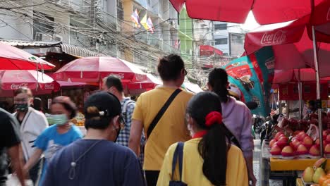 crowded market with vendors and shoppers