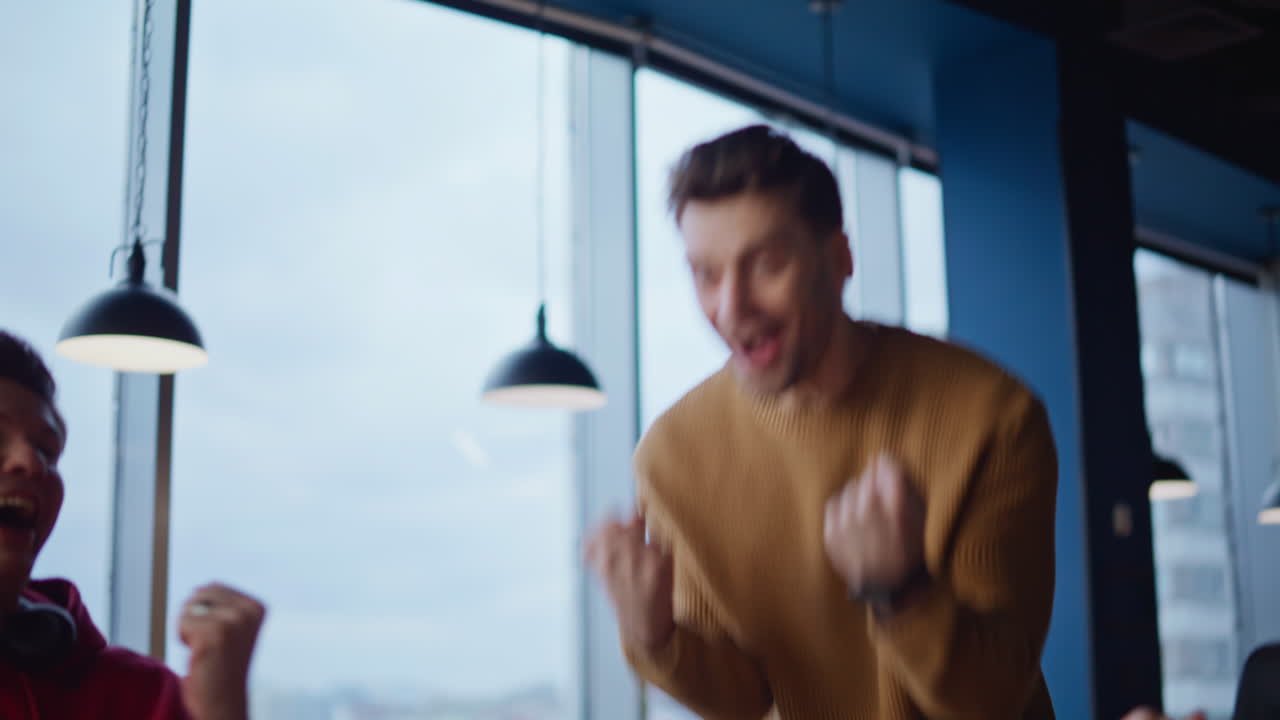 Excited Colleagues Celebrating Success with High-Fives and Cheering