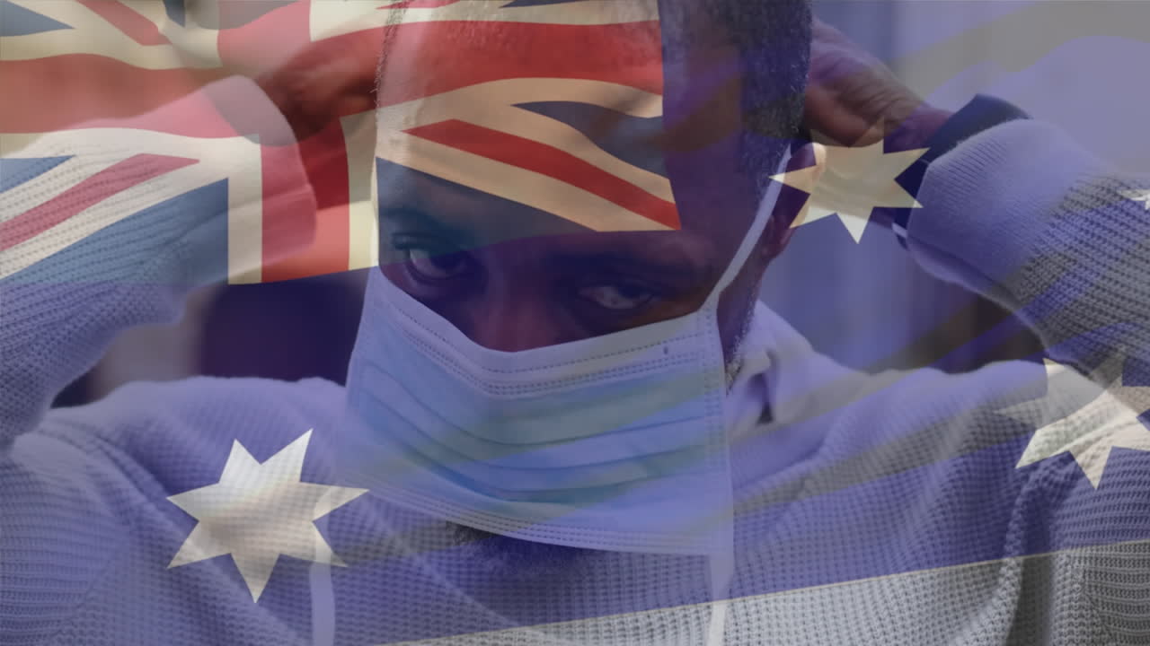 코로나 19 대유행 기간 동안 마스크를 쓴 남자가 호주 국기를 흔들고 있는 애니메이션