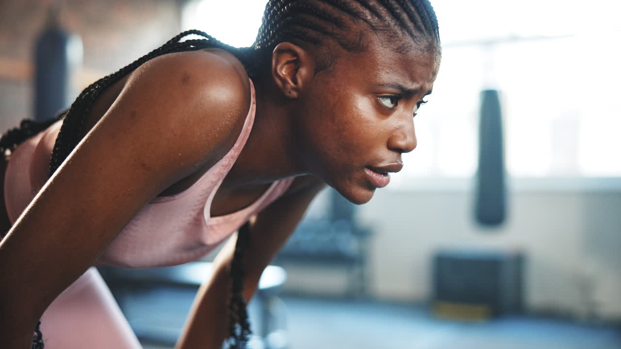 Tired, woman and breathing in gym for exercise