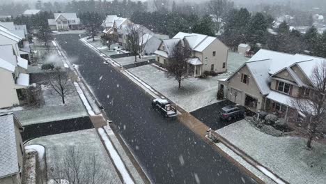 american neighborhood during winter snow storm
