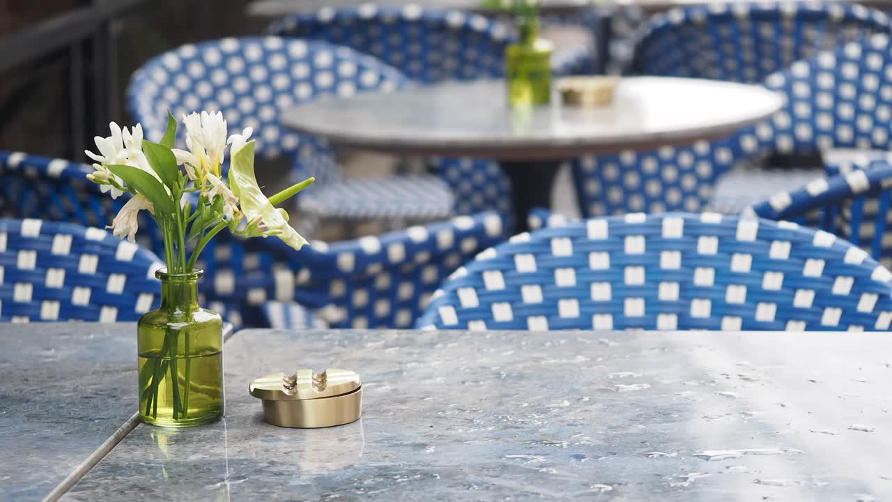 Outdoor Cafe Table Setting with Flowers