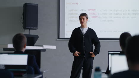 teenager presenting coding in classroom