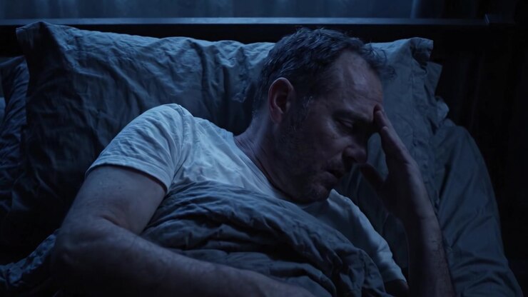 A Deep Dive into the Mind: A Troubled Man's Restless Night as He Lays in Bed, Reflecting on His Thoughts and Emotions in the Shadows of Darkness.