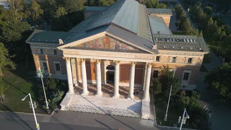 aerial boom shot above budapest palace of arts in city park