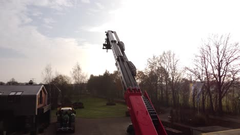 a drone flying over a crane