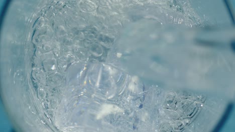 water cascading over ice cubes causing a refreshing splash