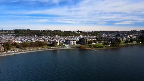 aerial view truck right of the coastal road in puerto varas, chile on a cloudy day