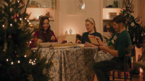 Young-friends-giving-high-five-sitting-at-home