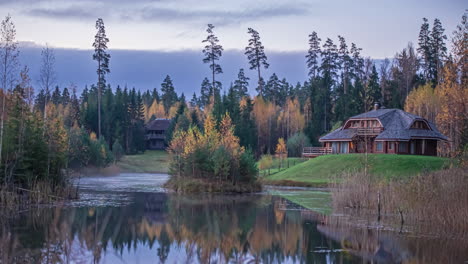 Idyllic-View-Of-Cottages-By-The-Lake-During-Autumn-Of-Early-Morning