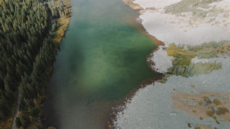 top-down drone shot 4k, alpine trees and lake, autumn, colorado