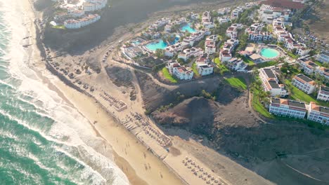 Aerial-view-of-a-luxury-hotel-along-the-coast-Hotel-Princess-Fuerteventura,-Canary-Islands,-Spain