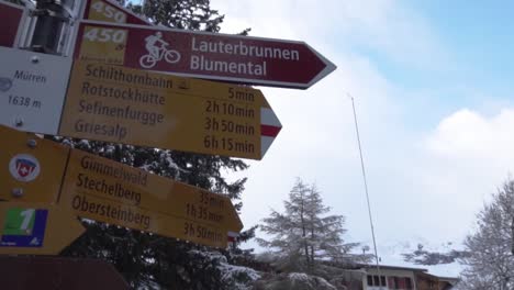 alpine hiking trail signs in winter