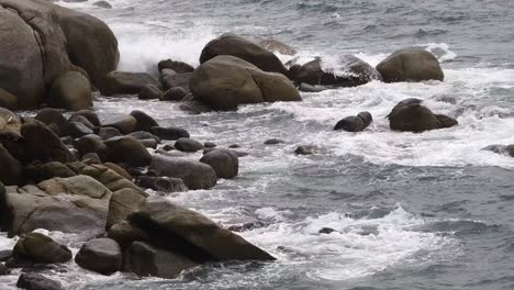 waves crashing against coastal rocks
