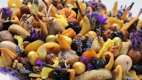 box filled with different dried fruits as a gift, circular motion