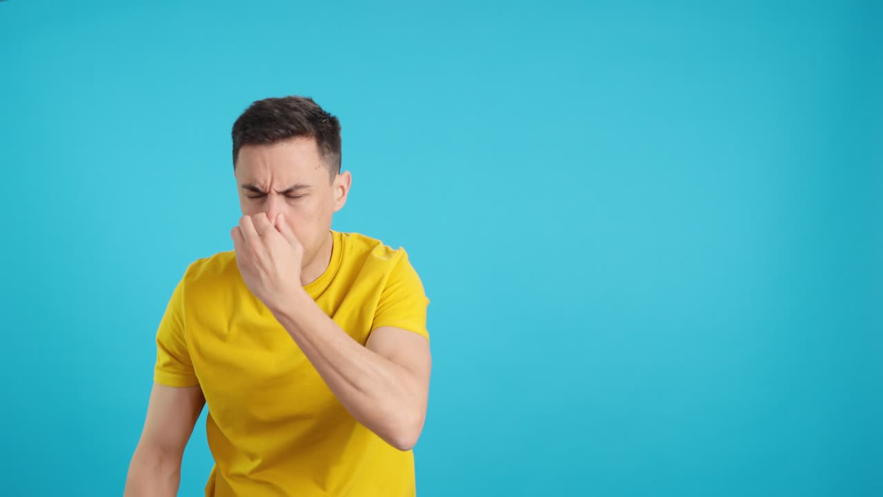 Man reacting to bad smell