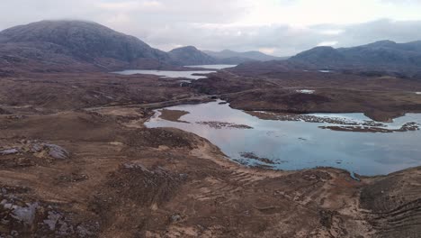 drone landscape footage of a moorland, peatland and mountain range on the isle of lewis, outer hebrides of scotland, united kingdom