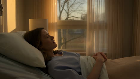 woman resting in a hospital bed