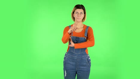 woman pointing and gesturing on green screen