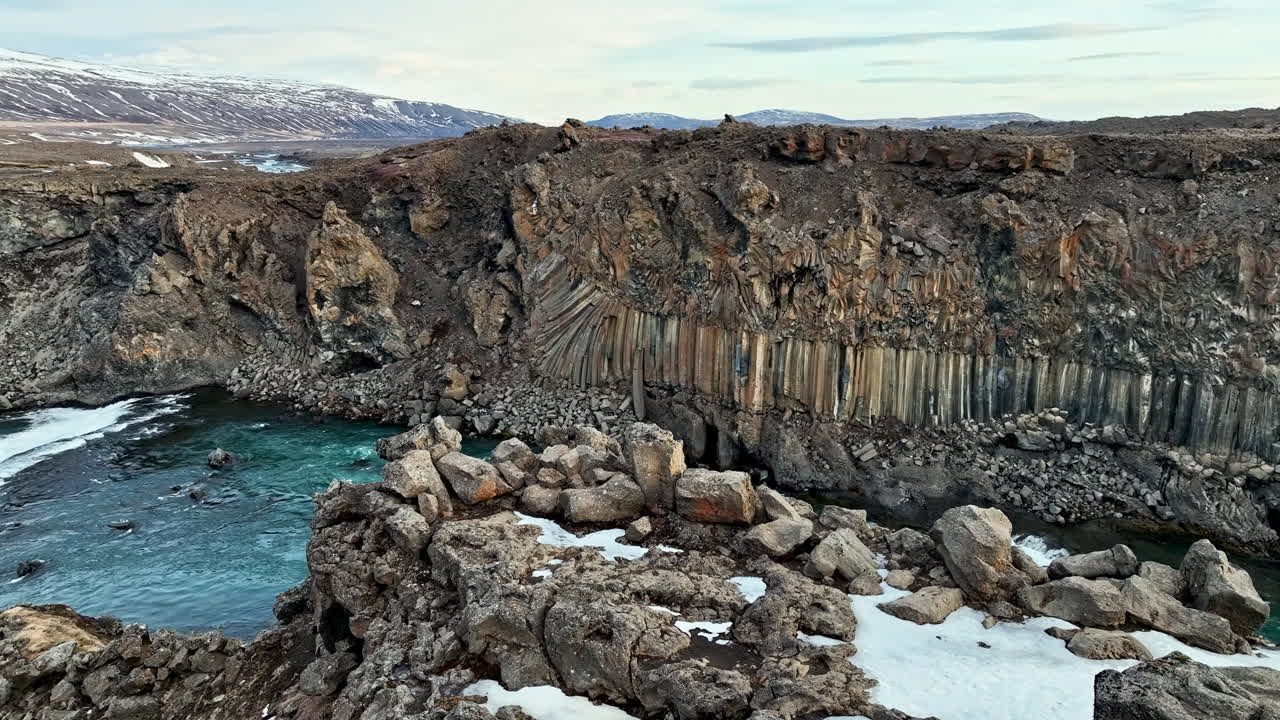 Drone moving over stones, toward the Aldeyjarfoss river, spring day in Iceland