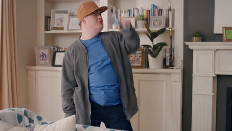 funny-teenager-boy-with-down-syndrome-dancing-in-living-room-special-needs-kid-having-fun-celebrating-with-silly-dance-moves-enjoying-happy-weekend-at-home-4k