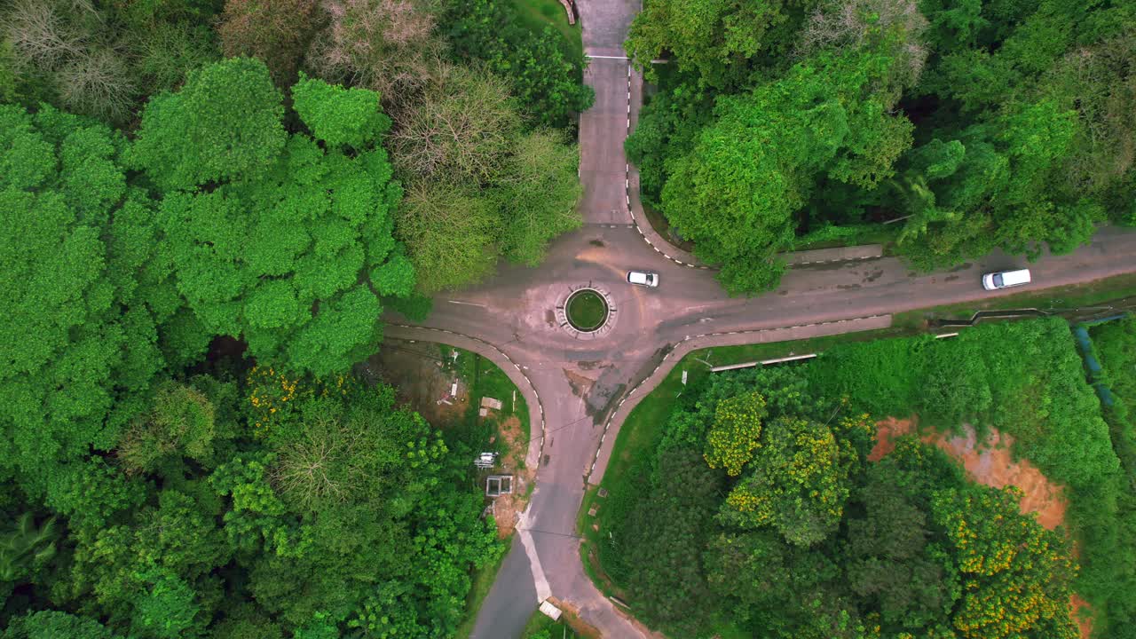 Mahe Seychelles small round about in urban location, few passing vehicles