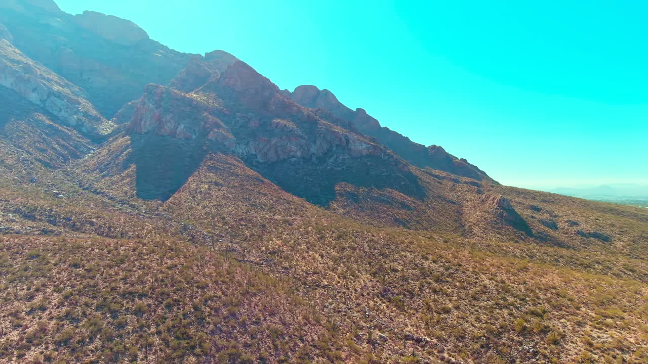 Cinematic rotating drone shot of mountains in Tucson Arizona