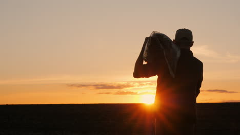 farmer at sunset