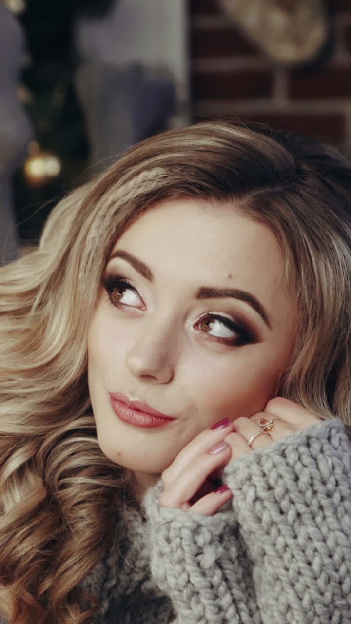 Beauty woman with christmas gift. Beautiful blonde woman with gifts at Christmas interior in room Vertical video