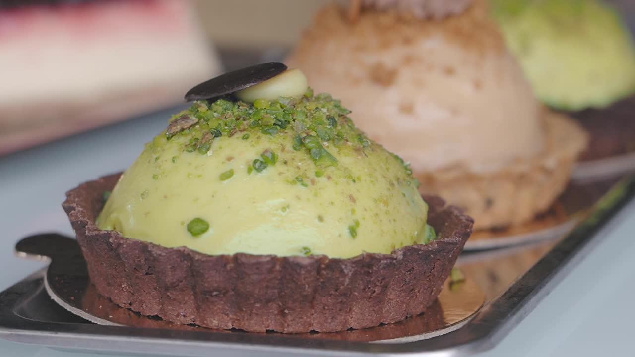 Assortment of gourmet pistachio and other pastries on a tray