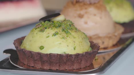 assortment of gourmet pistachio and other pastries on a tray