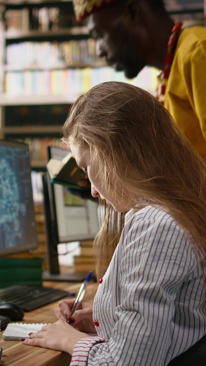 Vertical Video Young Adult Works At Desktop With Ai Learning Screens And Digital Tools