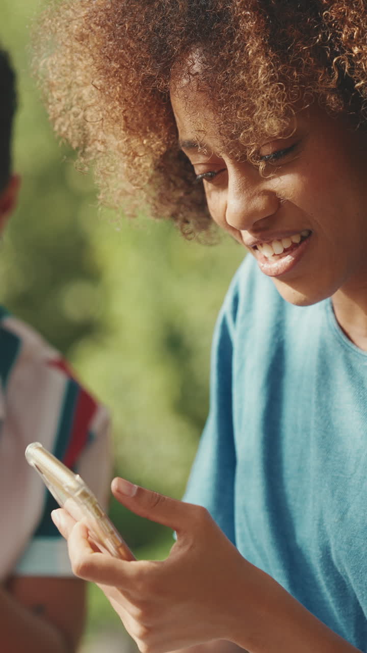 Woman using phone outdoors