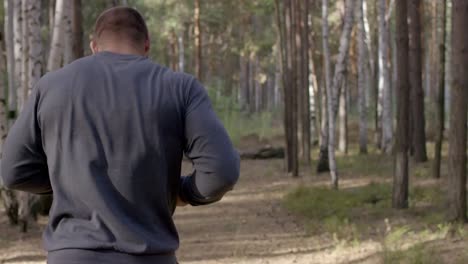 man walking in the forest