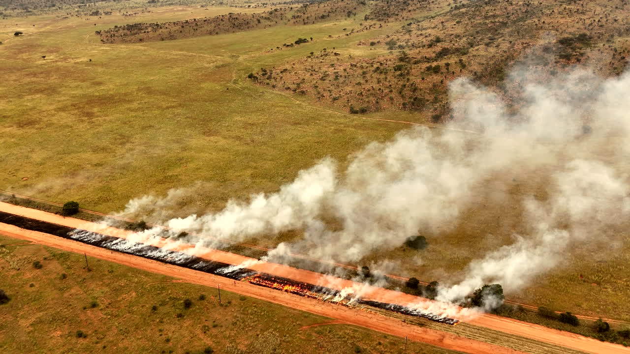 Aerial view of a buffer boundary burning for fire prevention and conservation