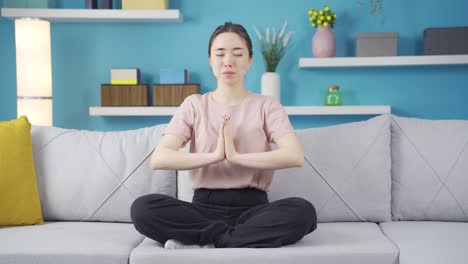 cheerful asian teenage girl meditating.