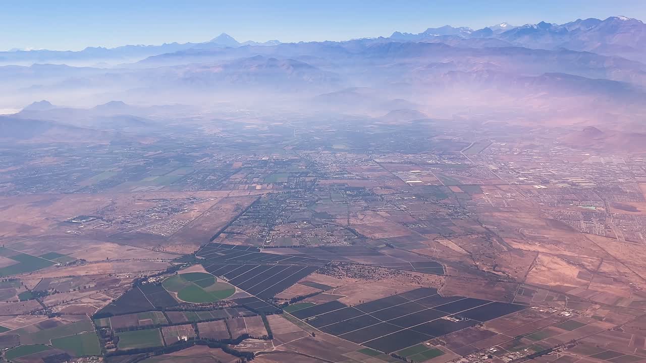 Flying over rural areas of Santiago de Chile in an airplane at the end of summer before the first rains.