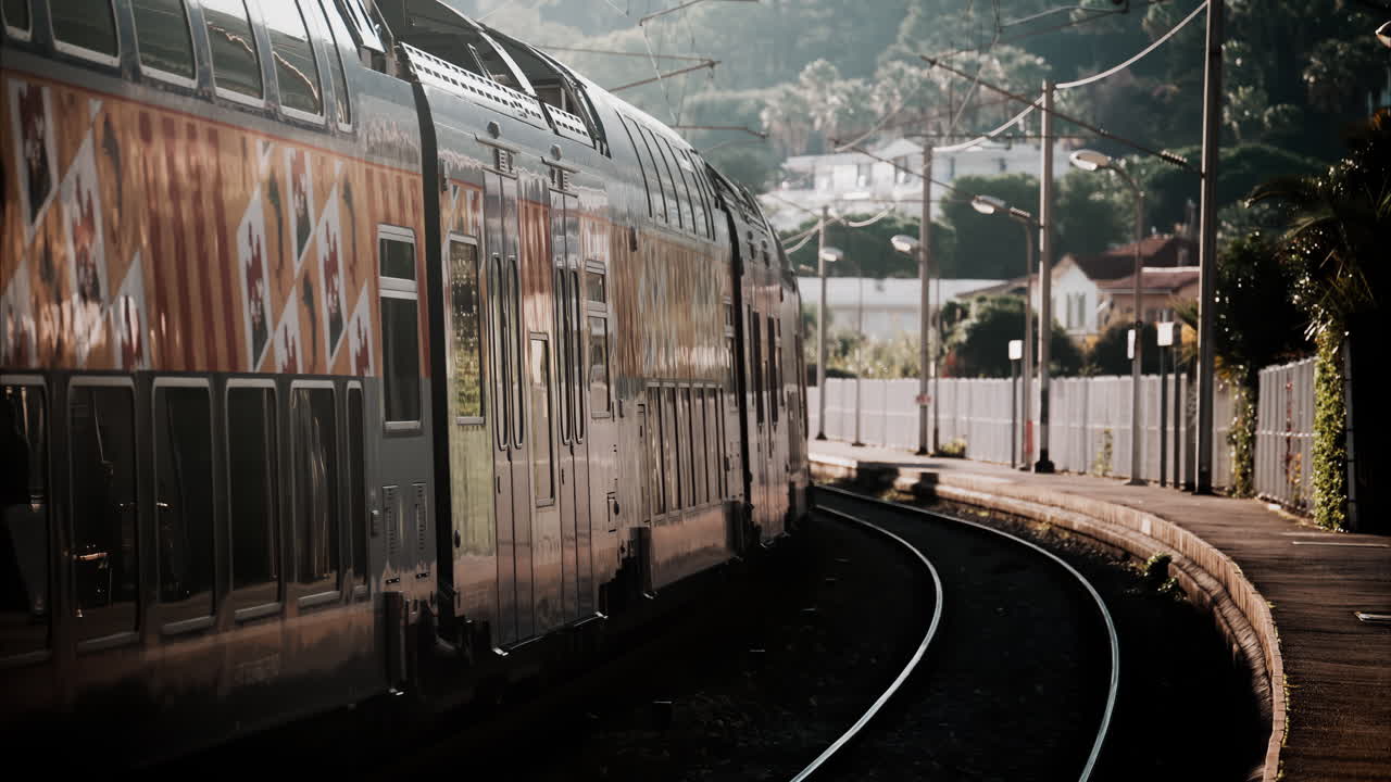 Close up of a train moving on the rails near a station in Nice, France